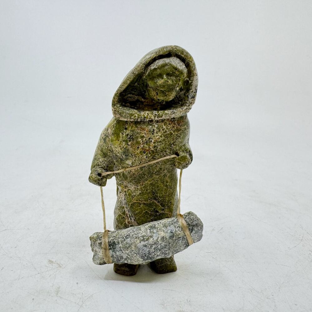 Inuit Handmade Sculpture of Standing Woman with Bedroll by Arci Ishulutuq